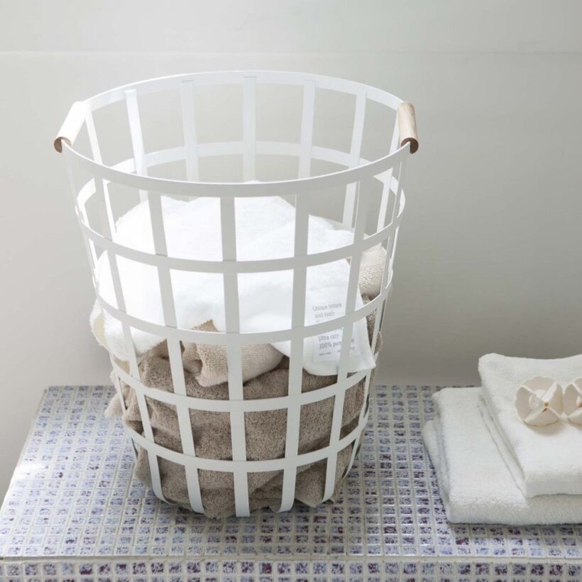 White Round Laundry Basket in Bathroom.